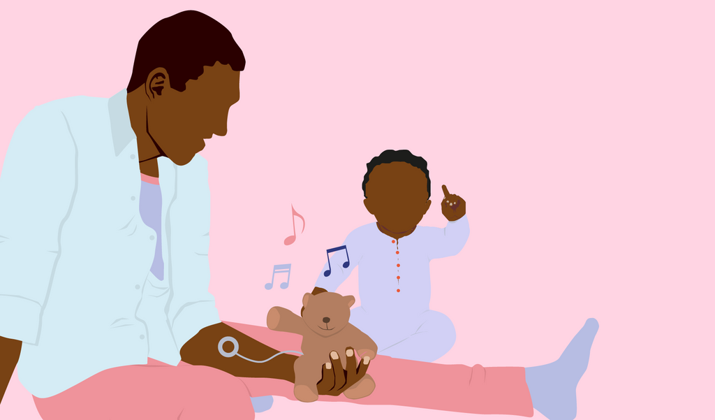 Ein Vater übt mit seinem Baby die Babyeichensprache